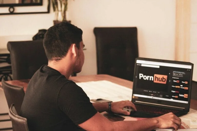 Man in black t-shirt using black laptop computer